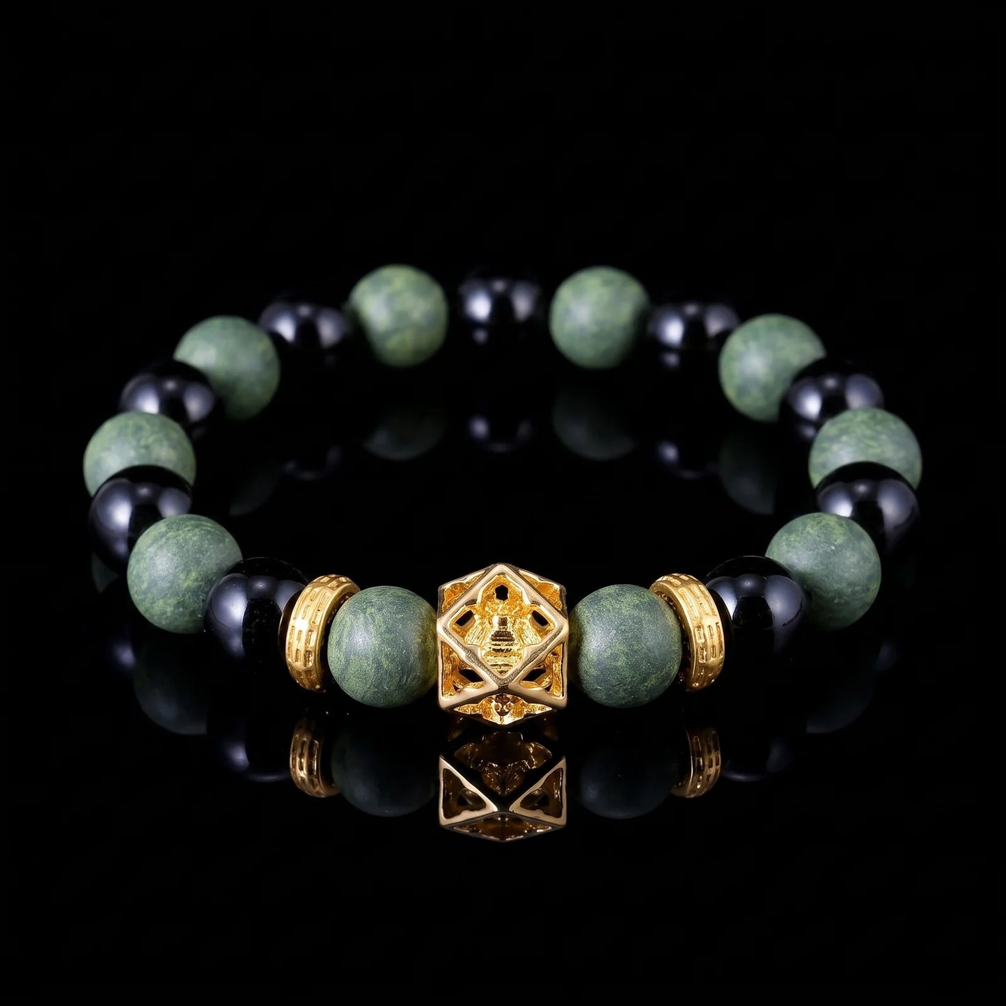 AZURE DRAGON Guardian Formula wearable incense bracelet with green and black beads on a black reflective surface.