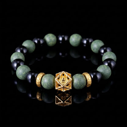 AZURE DRAGON Guardian Formula wearable incense bracelet with green and black beads on a black reflective surface.