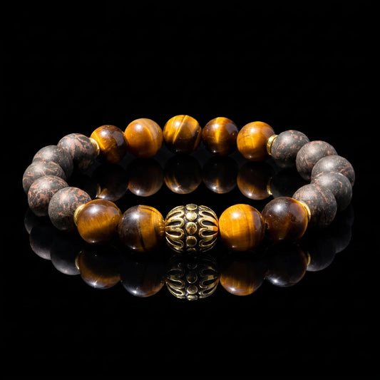 BLACK ACCORD Imperial Accord wearable incense bracelet with tiger eye beads and dark aromatic beads on a black reflective surface.