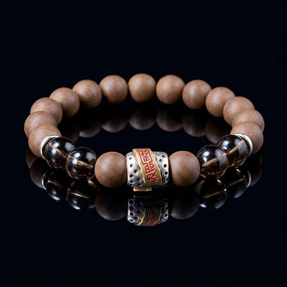 WARM YANG Guardian Formula wearable incense bracelet with warm brown beads on a black reflective surface.
