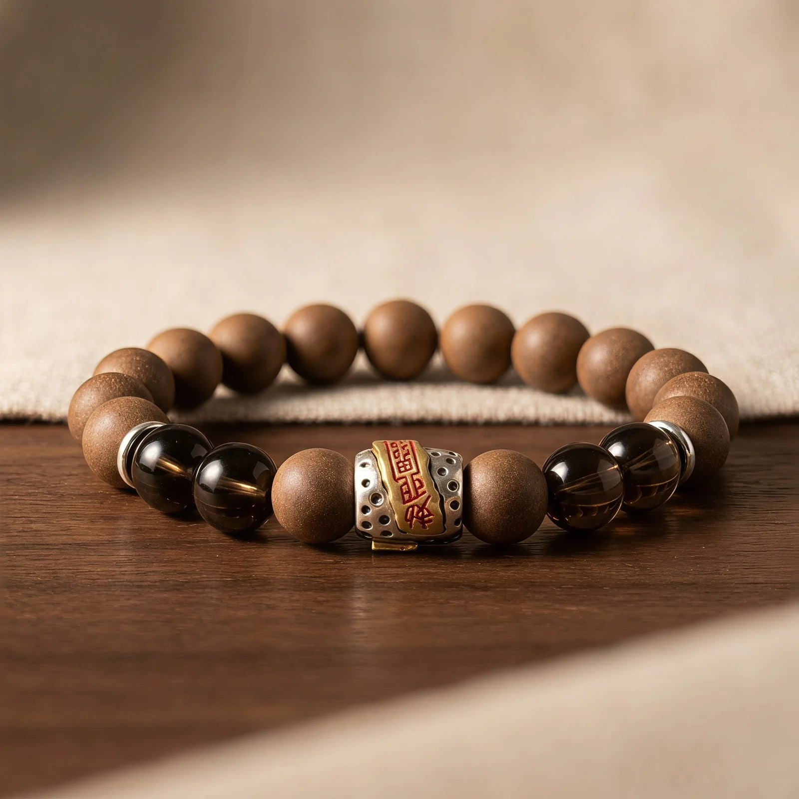 WARM YANG wearable incense bracelet placed on a warm wooden table for a grounded aromatic mood.