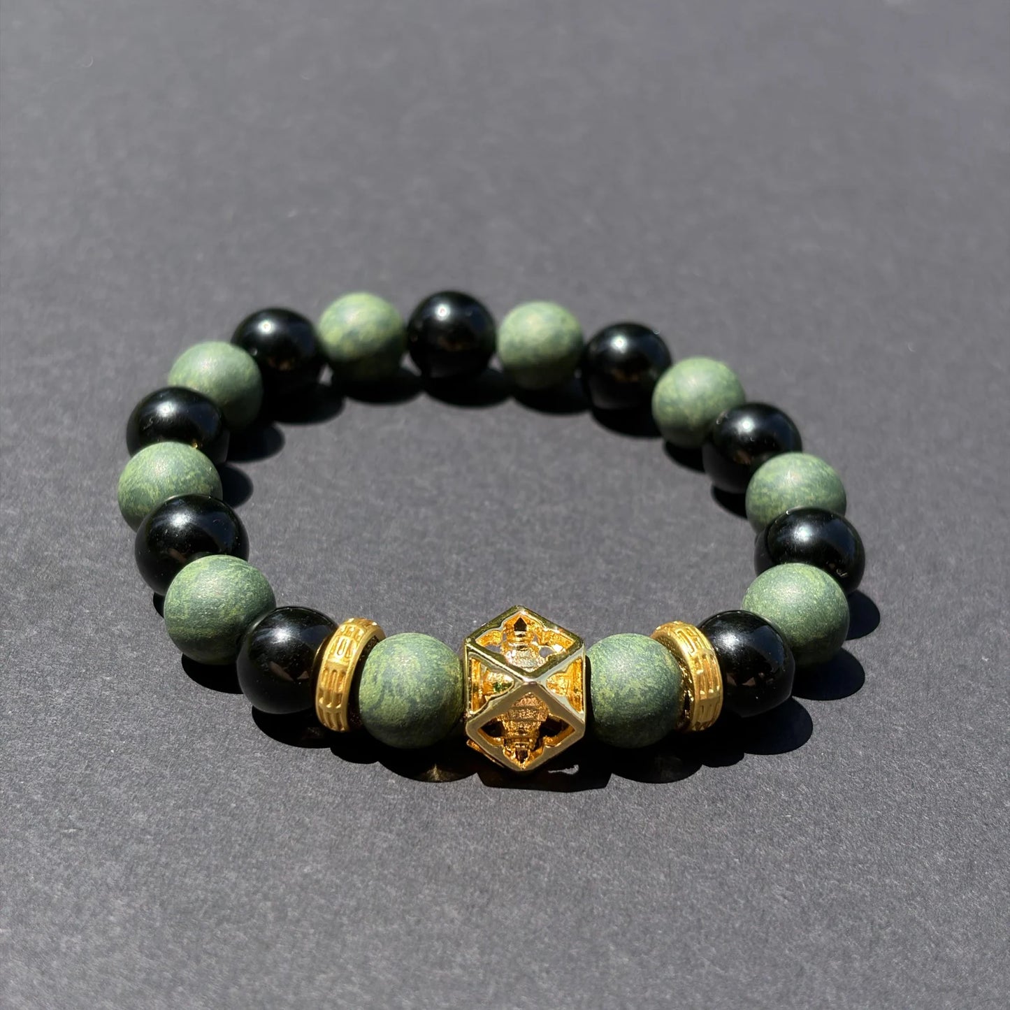 AZURE DRAGON wearable incense bracelet shown from an angled view on a clean gray surface.