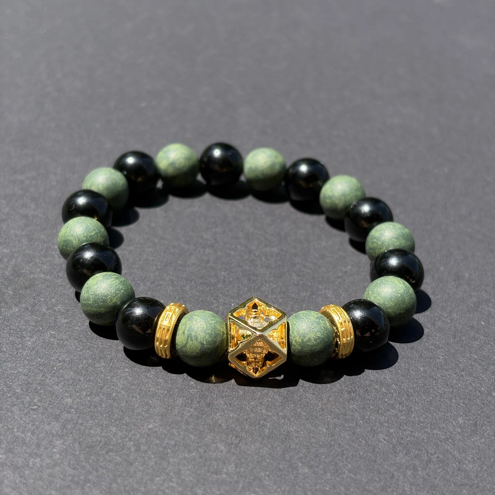 AZURE DRAGON wearable incense bracelet shown from an angled view on a clean gray surface.