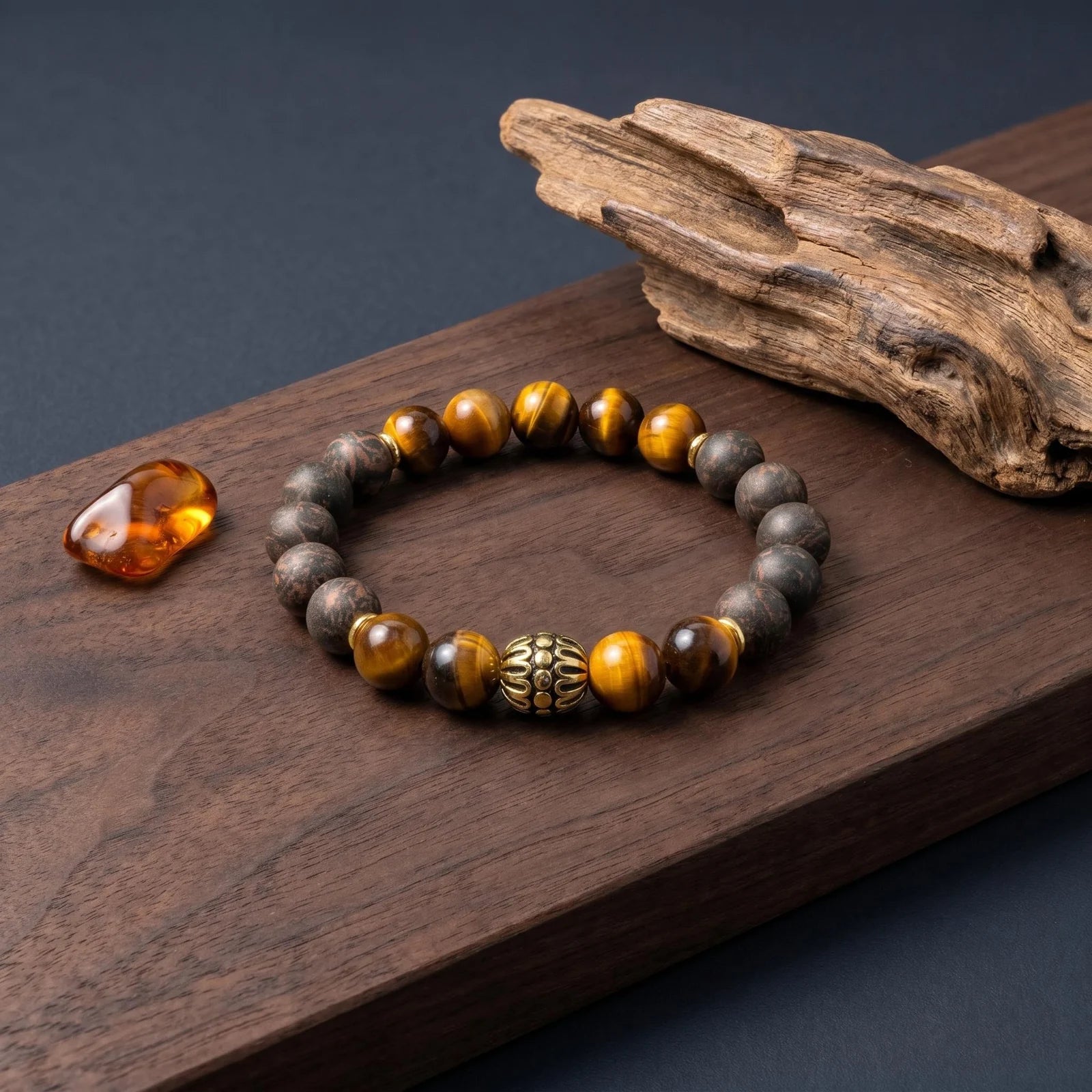 BLACK ACCORD wearable incense bracelet placed with agarwood material for a dark woody formula story.