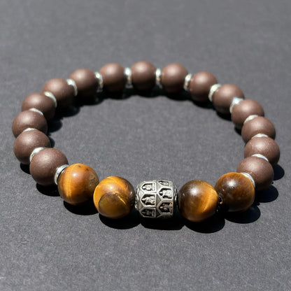 PEAR BLOSSOM aromatic bead bracelet shown from an angled view on a clean gray surface.