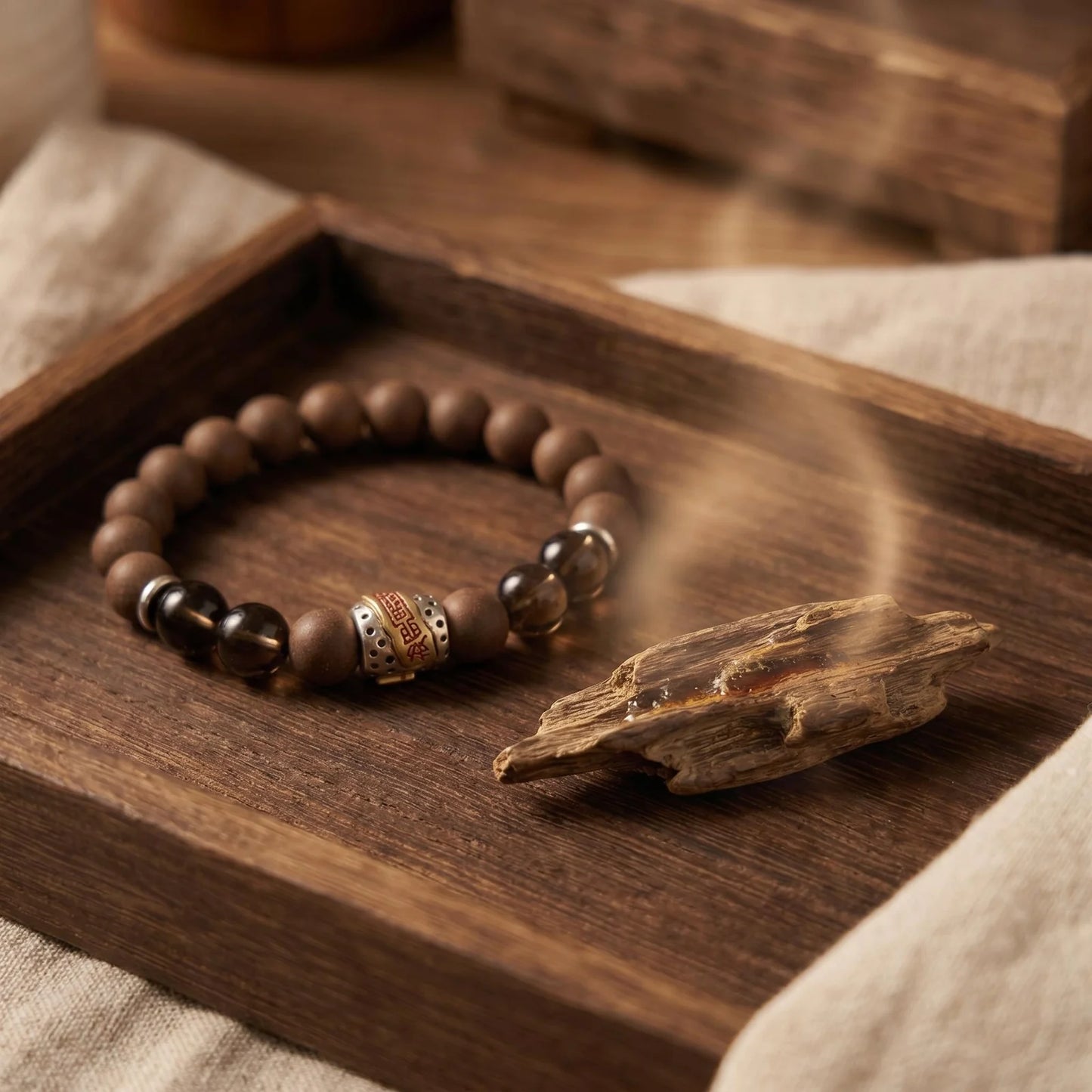 WARM YANG wearable incense bracelet shown with wood and soft incense atmosphere.