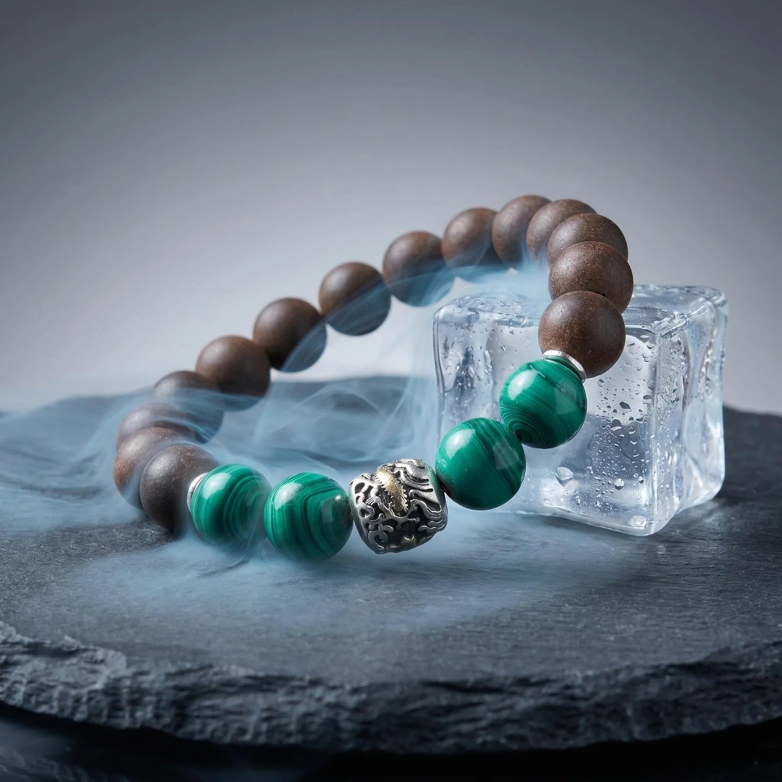 YONGZHENG COOL bracelet shown with ice and dark stone to suggest a cool close-to-skin scent character.