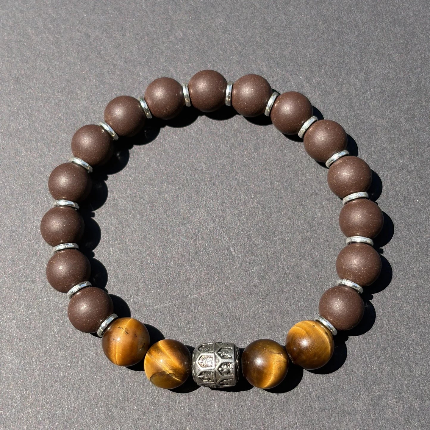 PEAR BLOSSOM wearable incense bracelet shown from above with brown beads and tiger eye accents.