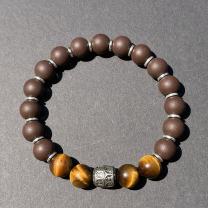 PEAR BLOSSOM wearable incense bracelet shown from above with brown beads and tiger eye accents.