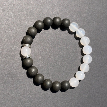 SKIN BREATH wearable incense bracelet shown from above with black and white bead balance.