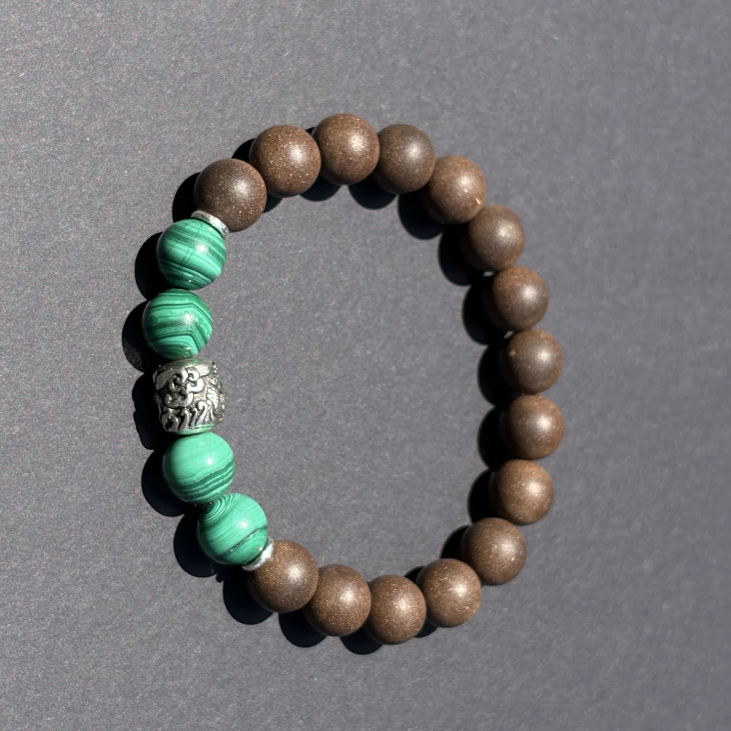 YONGZHENG COOL wearable incense bracelet shown from above with green accent beads.