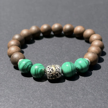 YONGZHENG COOL aromatic bead bracelet shown from an angled view on a clean gray surface.
