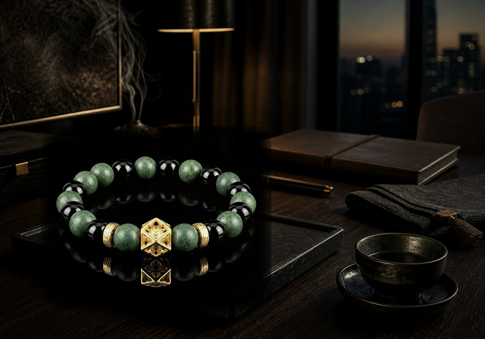 Azure Dragon wearable incense bracelet on a dark study desk