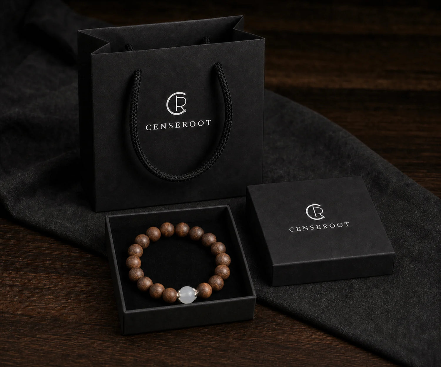 CENSEROOT Quiet Moon bracelet displayed inside the black gift-ready presentation box with carrying bag.