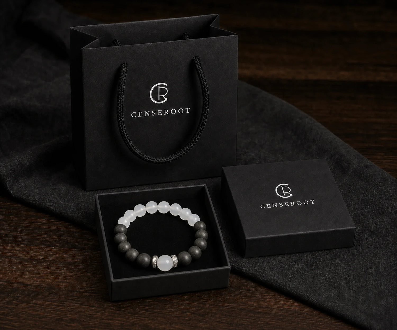 CENSEROOT Still Point bracelet displayed inside the black gift-ready presentation box with carrying bag.