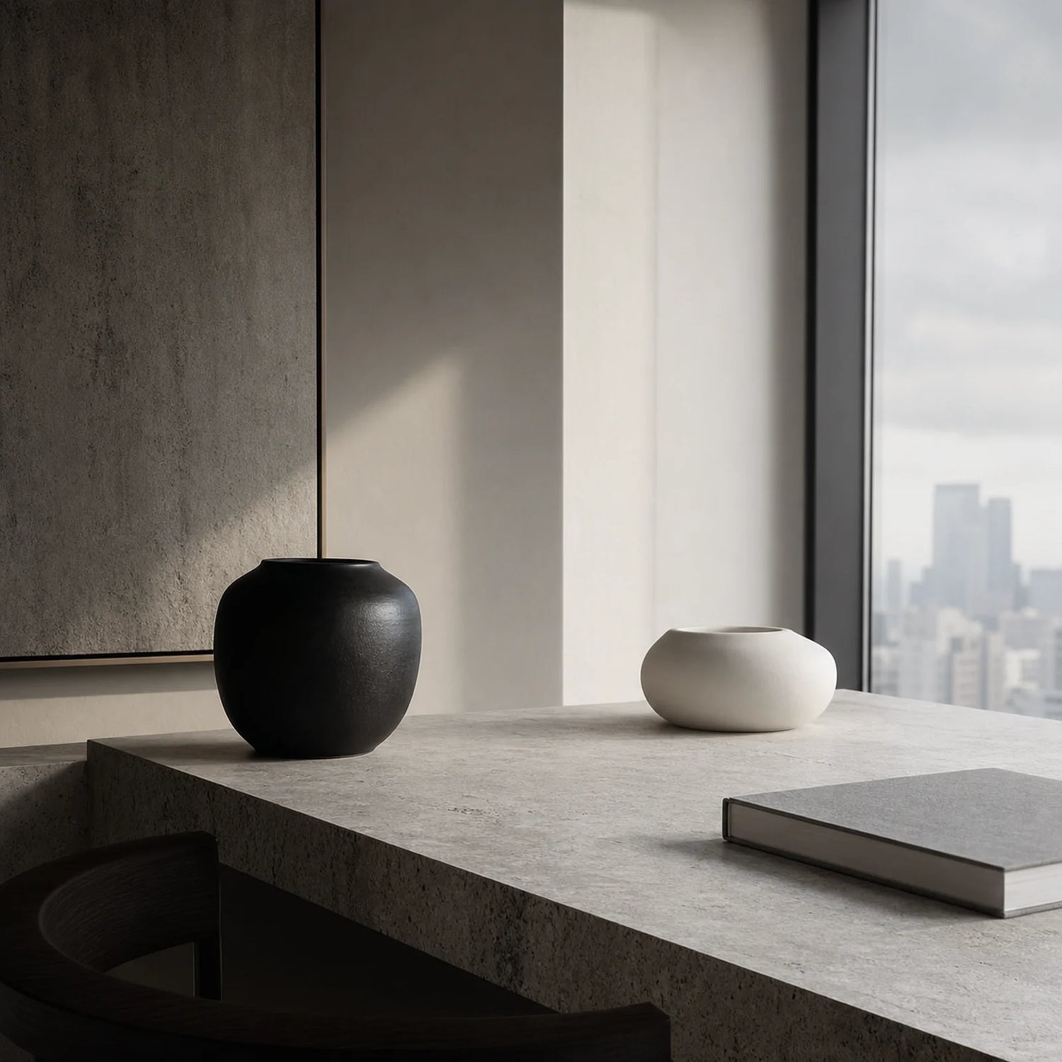 CENSEROOT Still Point scene image showing a balanced minimalist apartment corner with black and white ceramics, stone, gray book, and soft window light.