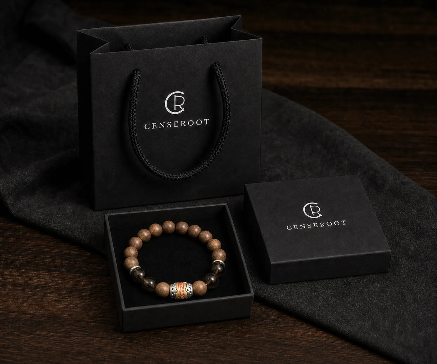 CENSEROOT Warm Ember bracelet displayed inside the black gift-ready presentation box with carrying bag.