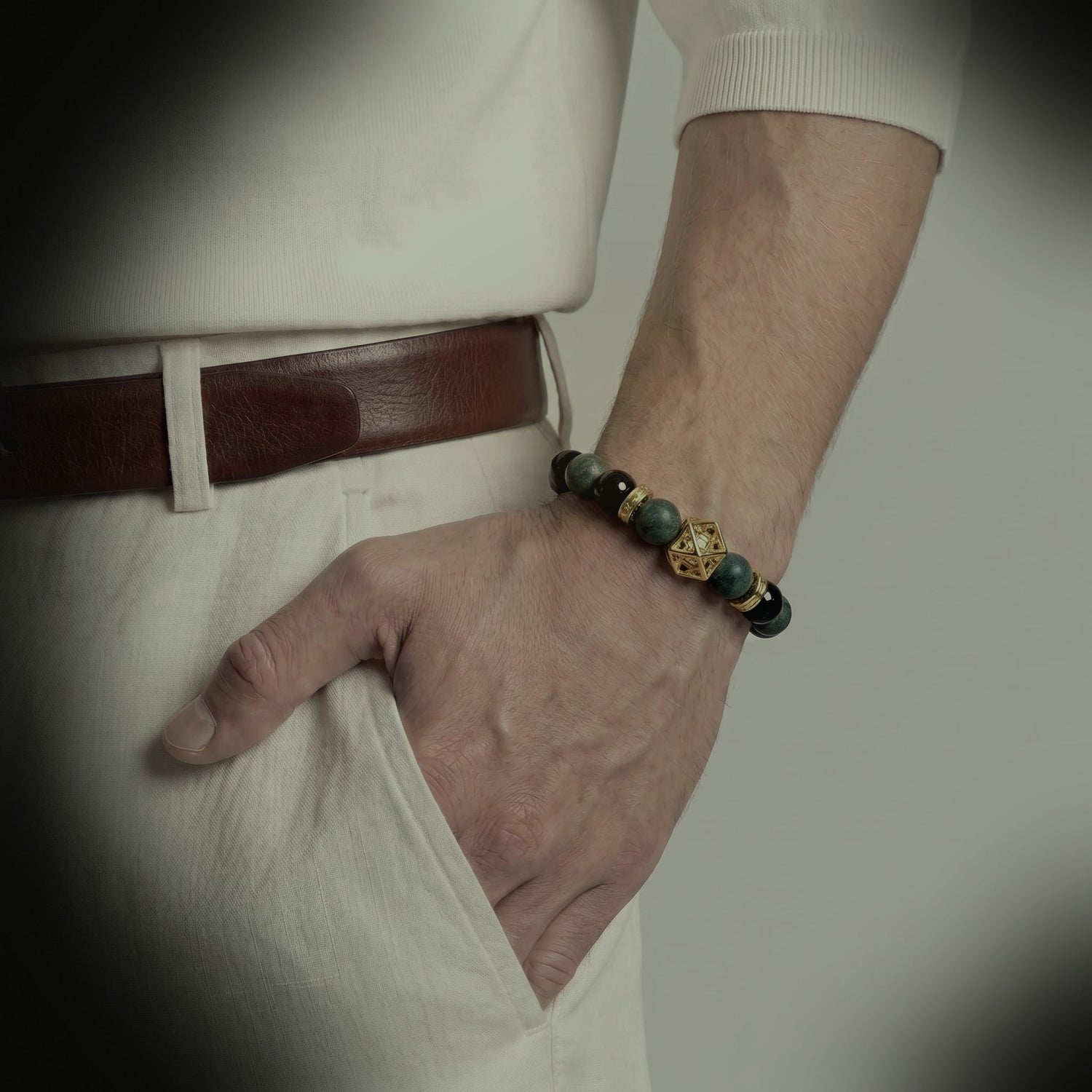 Azure Dragon bracelet worn with cream clothing and leather belt